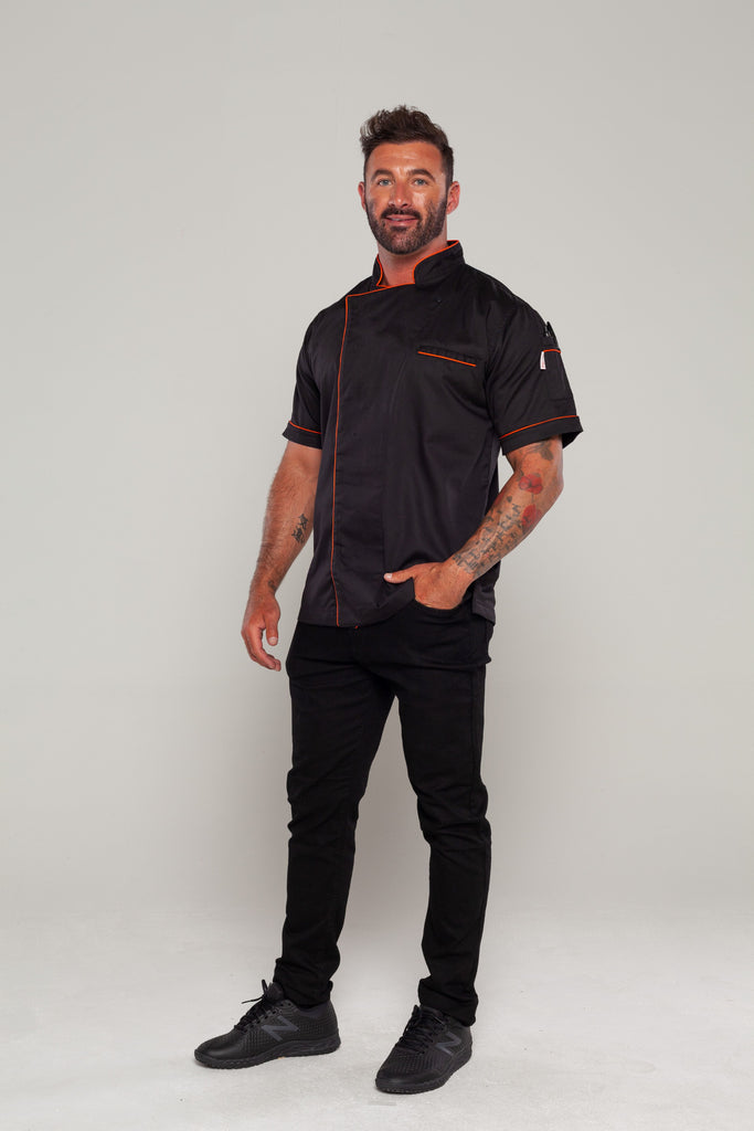 black chef jacket with orange trim and black pant